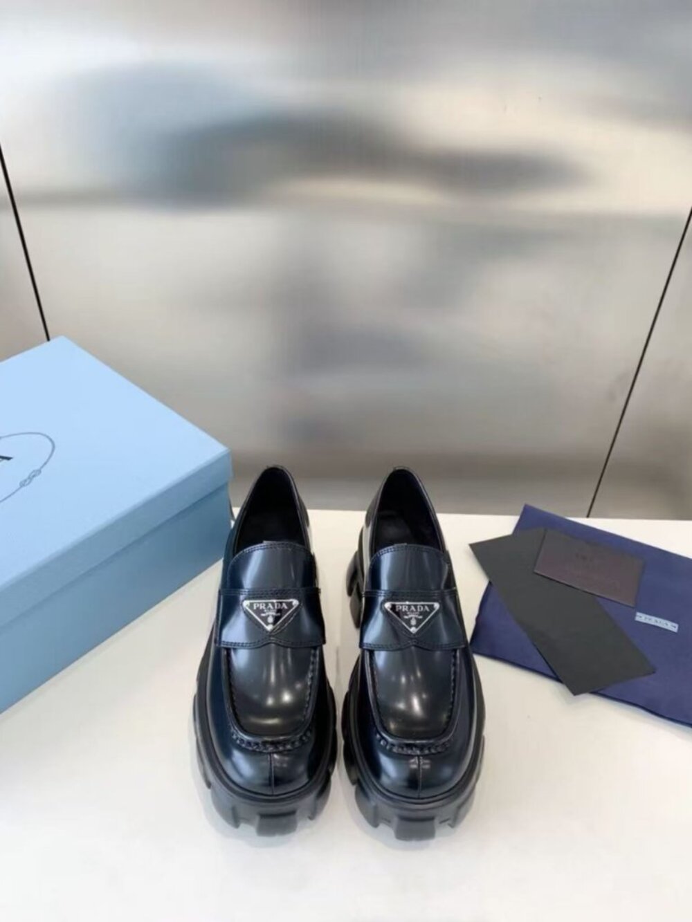 Prada Monolith Black Leather Lug Sole Loafers